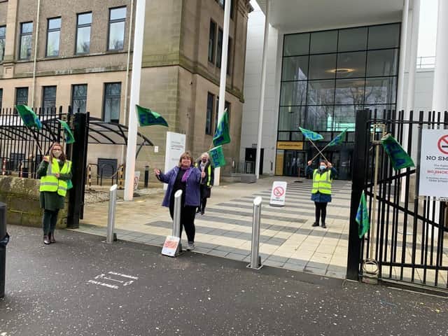 Picketing at colleges has been socially-distanced.