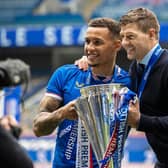Rangers' James Tavernier lifts the Premiership trophy (left) with then manager Steven Gerrard on May 15, 2021. (Photo by Craig Williamson / SNS Group)