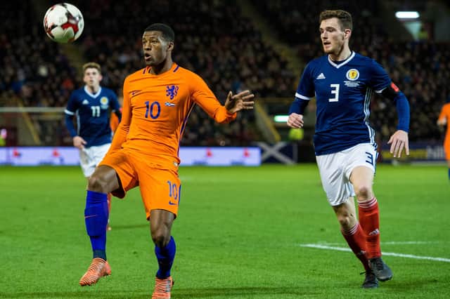 Georginio Wijnaldum in action against Andrew Robertson during a friendly between Scotland and the Netherlands at Pittodrie in November 2017. Picture: SNS