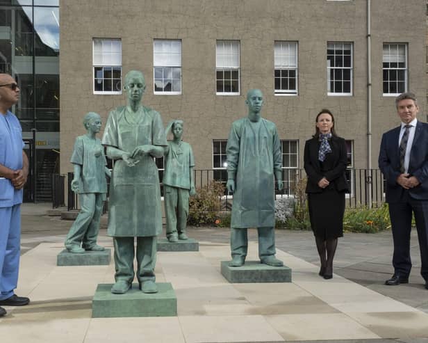 (L-R) Nirmal Kumar, Clare McNaught, Professor Michael Griffin at an unveiling of  a new sculpture which they helped to inspire at the Royal College of Surgeons of Edinburgh grounds