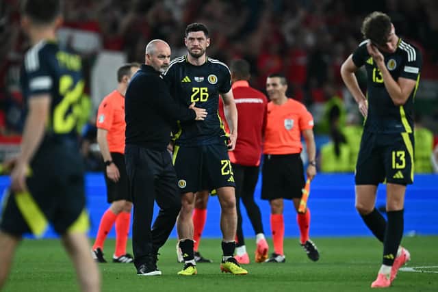 Scotland head coach Steve Clarke consoles his players after the 1-0 defeat to Hungary which knocked his side out of Euro 2024. (Photo by FABRICE COFFRINI/AFP via Getty Images)