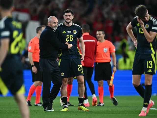 Scotland head coach Steve Clarke consoles his players after the 1-0 defeat to Hungary which knocked his side out of Euro 2024. (Photo by FABRICE COFFRINI/AFP via Getty Images)