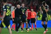 Scotland head coach Steve Clarke consoles his players after the 1-0 defeat to Hungary which knocked his side out of Euro 2024. (Photo by FABRICE COFFRINI/AFP via Getty Images)