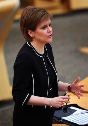 Scotland's First Minister Nicola Sturgeon attends a session at the Scottish Parliament where she delivered an update on the Covid-19 pandemic, in Holyrood, Edinburgh on March 9, 2021. (Photo by Andy Buchanan / POOL / AFP).