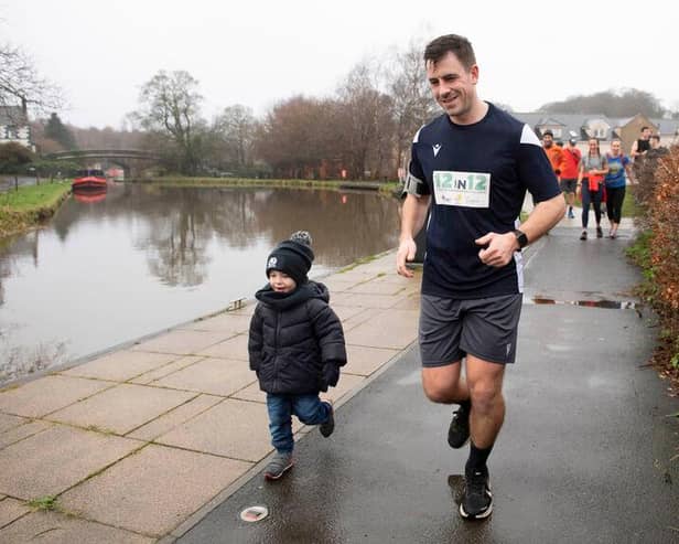 Chris Laidlaw, son of the former Scotland and British & Irish Lions scrum-half Roy Laidlaw, runs alongside the Union Canal by his son Struan.
(Photo by Paul Devlin / SNS Group)