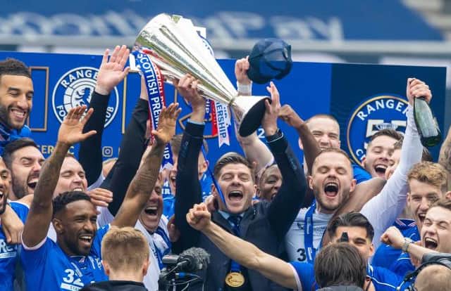 Rangers manager Steven Gerrard and his players celebrate after lifting the Premiership trophy at Ibrox on May 15. (Photo by Craig Williamson / SNS Group)
