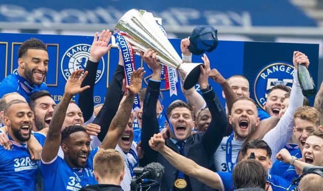 Rangers manager Steven Gerrard and his players celebrate after lifting the Premiership trophy at Ibrox on May 15. (Photo by Craig Williamson / SNS Group)