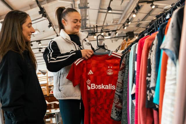 Aberdeen player Emma Ilijoski donates a shirt to the Salvation Army to keep kit in play for longer