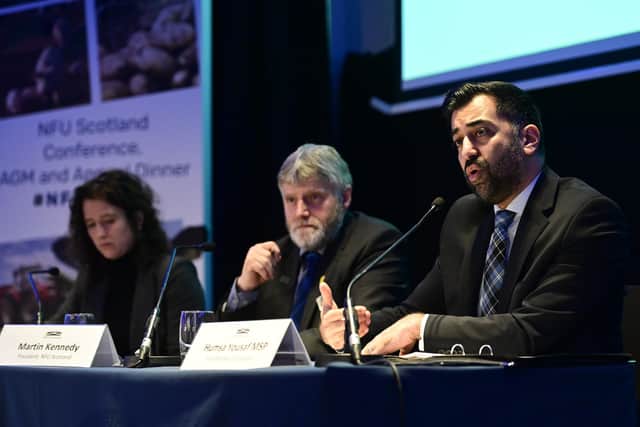First minister Humza Yousaf giving a keynote speech at the NFUS AGM alongside the union's president Martin Kennedy and rural affairs secretary Mairi Gougeon (pic: John Devlin/The Scotsman)