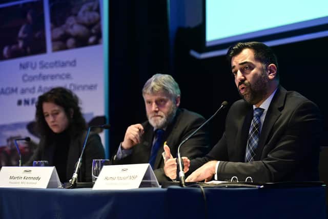 First minister Humza Yousaf giving a keynote speech at the NFUS AGM alongside the union's president Martin Kennedy and rural affairs secretary Mairi Gougeon (pic: John Devlin/The Scotsman)