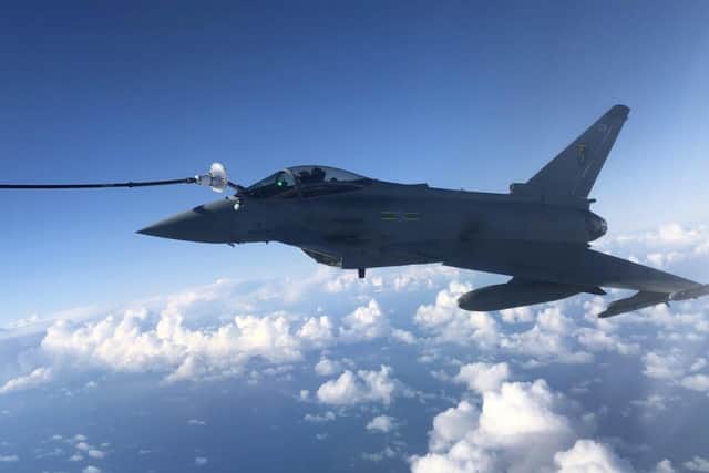 A RAF Typhoon combat aircraft refuels from an RAF Voyager aircraft over the North Sea on October 08, 2020 in flight, above Scotland.