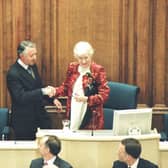Winnie Ewing MSP hands over the chair to the newly elected presiding officer, Sir David Steel, on the opening day of the Scottish Parliament (Picture: Scottish Parliament via Getty Images)