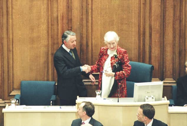 Winnie Ewing MSP hands over the chair to the newly elected presiding officer, Sir David Steel, on the opening day of the Scottish Parliament (Picture: Scottish Parliament via Getty Images)