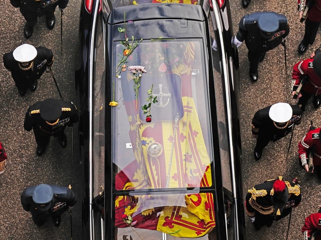Flowers on the hearse carrying the coffin of Queen Elizabeth II as it arrives at Windsor Castle for the Committal Service in St George's Chapel. Picture date: Monday September 19, 2022.