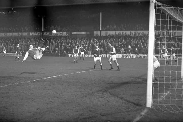 Acrobatically keeping Hearts at bay for boyhood heroes Hibs in his last-ever derby in March, 1976.