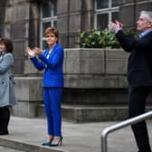 First Minister Nicola Sturgeon shows her appreciation for NHS and key workers on the frontline of the coronavirus outbreak (Picture: Jeff J Mitchell/Getty Images)