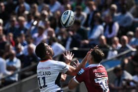 Scotland winger Sean Maitland and Tom Roebuck - who may represent the Scots in the future - challenge for the ball.