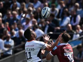 Scotland winger Sean Maitland and Tom Roebuck - who may represent the Scots in the future - challenge for the ball.