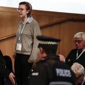 A protestor from This Is Rigged is led away from the chamber during First Minister's Questions. Picture: Getty Images