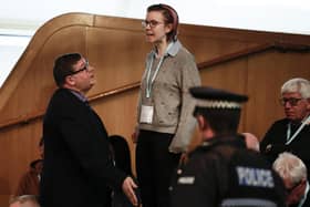 A protestor from This Is Rigged is led away from the chamber during First Minister's Questions. Picture: Getty Images