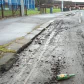 Debris in a cycle lane in Bilsland Drive in the Ruchill area of north Glasgow – complete with an empty Buckfast bottle (Picture: The Scotsman)