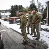 Marines from 45 Commando carry out welfare checks in Lumphanan, after Storm Arwen left many people without power (Picture: Peter Summers/Getty Images)