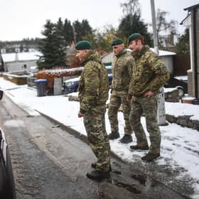 Marines from 45 Commando carry out welfare checks in Lumphanan, after Storm Arwen left many people without power (Picture: Peter Summers/Getty Images)