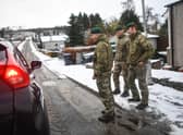 Marines from 45 Commando carry out welfare checks in Lumphanan, after Storm Arwen left many people without power (Picture: Peter Summers/Getty Images)