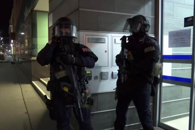 Police at the scene after gunshots were heard, in Vienna, Monday, Nov. 2, 2020