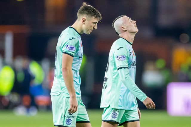 KILMARNOCK, SCOTLAND - NOVEMBER 12: Hibs' Josh Campbell (L) and Harry McKirdy look dejected at full time after the loss at Kilmarnock,