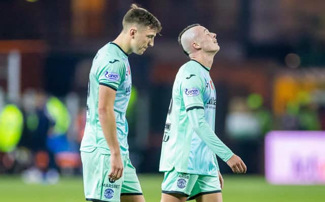 KILMARNOCK, SCOTLAND - NOVEMBER 12: Hibs' Josh Campbell (L) and Harry McKirdy look dejected at full time after the loss at Kilmarnock,