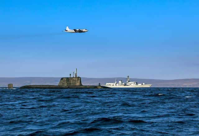 From the Joint Warrior biannual NATO exercise. An Astute class nuclear submarine in company with the Type 23 frigate HMS Kent being over flown by a German Navy P3 maritime patrol aircraft. Pic: Jim Gibson/ Royal Navy