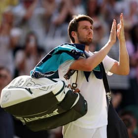 Cameron Norrie leaves the court after defeat to Novak Djokovic in the Wimbledon semi-final. (Photo by Ryan Pierse/Getty Images)