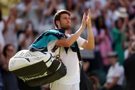 Cameron Norrie leaves the court after defeat to Novak Djokovic in the Wimbledon semi-final. (Photo by Ryan Pierse/Getty Images)