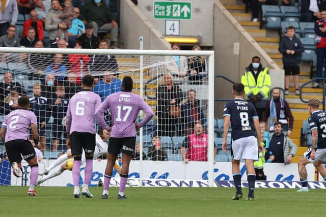 Jon McLaughlin saves a Jason Cummings penalty.