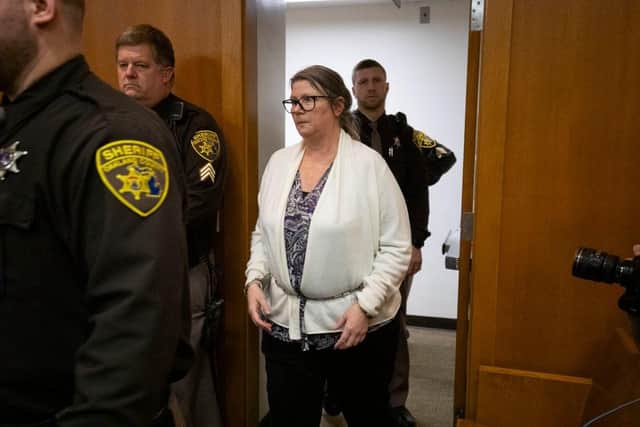 Jennifer Crumbley, the mother of Oxford, Michigan high school shooter Ethan Crumbley, enters the court to hear the verdict just before the jury found her guilty on four counts of involuntary manslaughter.