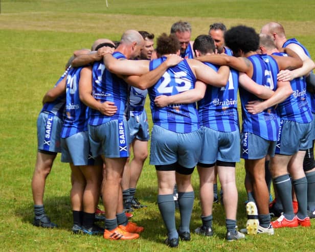 The Kingdom Kangaroos huddle at half time during one of their matches in 2022. Picture: John Kinninmonth