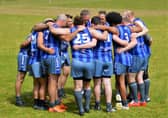 The Kingdom Kangaroos huddle at half time during one of their matches in 2022. Picture: John Kinninmonth