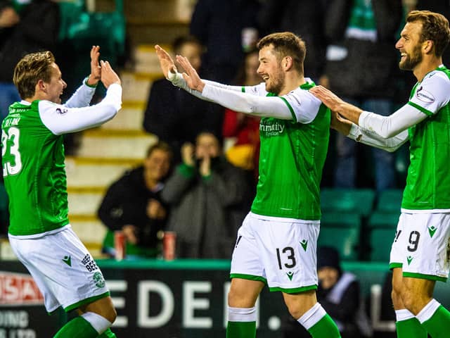 Hibs' Marc McNulty is congratulated by Scott Allan (L) after making it 1-0 during a Ladbrokes Premiership match between Hibernian and Ross County at Easter Road on February 12