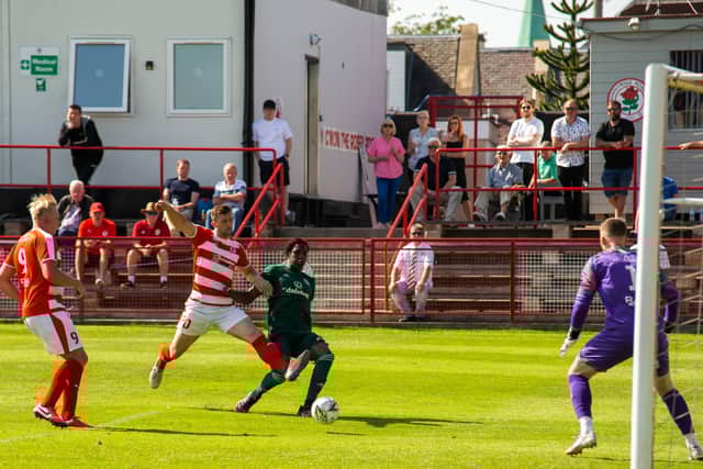 Celtic's Bosun Lawal scores to make it 2-1 during the Lowland League Match between Bonnyrigg Rose and Celtic B at New Dundas Park on July 17, 2021.