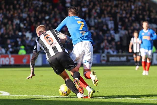 Ianis Hagi is brought down just inside the box by St Mirren midfielder Alan Power for the penalty which saw Rangers equalise in their 2-1 win in Paisley. (Photo by Craig Williamson / SNS Group)