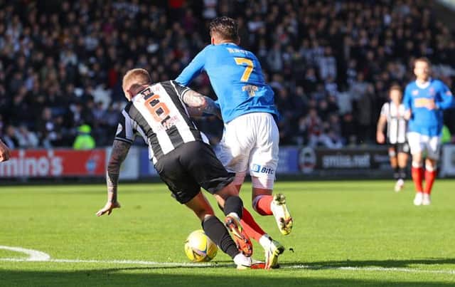 Ianis Hagi is brought down just inside the box by St Mirren midfielder Alan Power for the penalty which saw Rangers equalise in their 2-1 win in Paisley. (Photo by Craig Williamson / SNS Group)