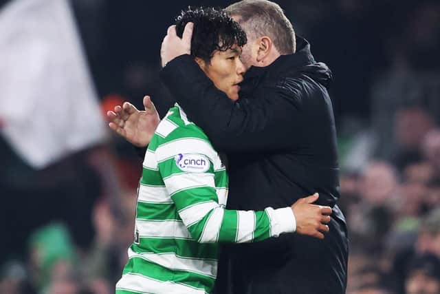 Celtic manager Ange Postecoglou hugs Reo Hatate as he leaves the field following a scintillating debut that earned a stunned reaction which, in common with the acclaim for debutant scorer Daizen Maeda, could impact on the Japanese pair's club availability over the coming weeks. Photo by Alan Harvey / SNS Group)