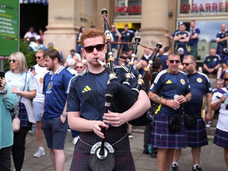 A Scotland fan plays the bagpipes in Stuttgart ahead of their Euro 2024 group A game against Hungary this evening.