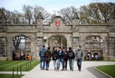 Students outside of the entrance to the Lower and Upper College Halls at the University of St Andrews. Picture: PA