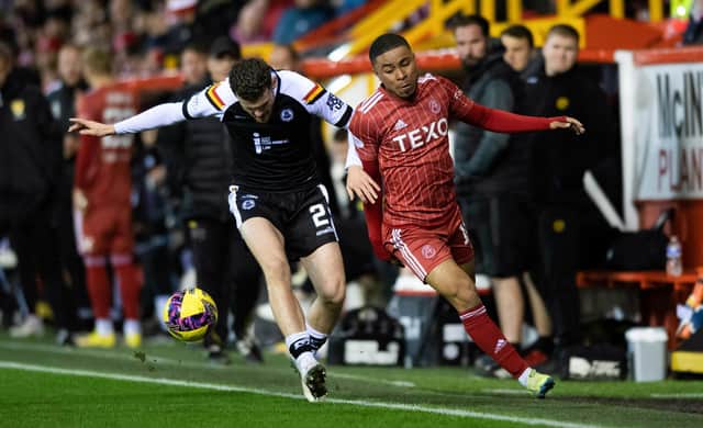 Aberdeen's Vicente Besuijen (right) is challenged by Partick's Jack McMillan in the Premier Sports Cup quarter-final clash at Pittdorie. (Photo by Mark Scates / SNS Group)