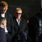 Neil Lennon and son Gallagher watch last season's Premiership play-off tie between Queen's Park and Partick Thistle at Ochilview. The former Hibs manager was back at Easter Road yesterday. (Photo by Rob Casey / SNS Group)