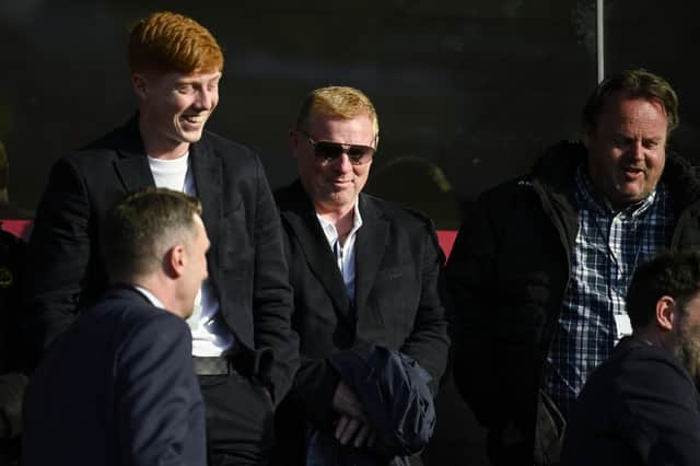 Neil Lennon and son Gallagher watch last season's Premiership play-off tie between Queen's Park and Partick Thistle at Ochilview. The former Hibs manager was back at Easter Road yesterday. (Photo by Rob Casey / SNS Group)