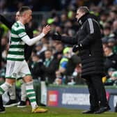 Celtic's David Turnbull shakes hands with his manager Ange Postecoglou after a rare start against Morton.