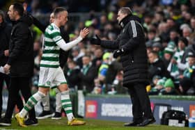 Celtic's David Turnbull shakes hands with his manager Ange Postecoglou after a rare start against Morton.